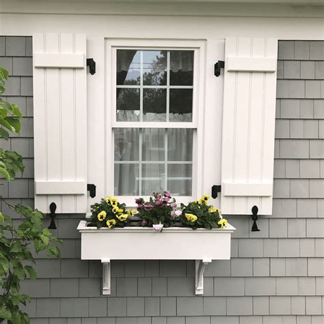 white exterior shutters for windows.